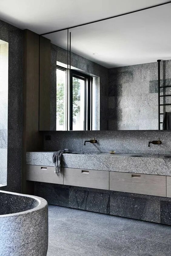 Ванная в бетоне фото Concrete sinks, brassware and stone from Bert and May Industrial style bathroom,