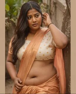 A indian.plus size bhabhi wearing red skirt and pink blouse, she has big be...
