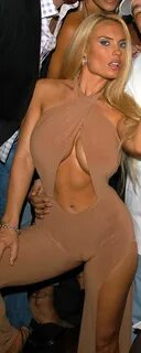 Coco with a camel toe in a beige one-piece.