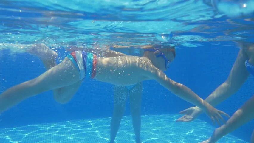 Pool boy Underwater. Scuba boy. Sonic learns to Swim. Woman swimming Underwater in Slow Motion.