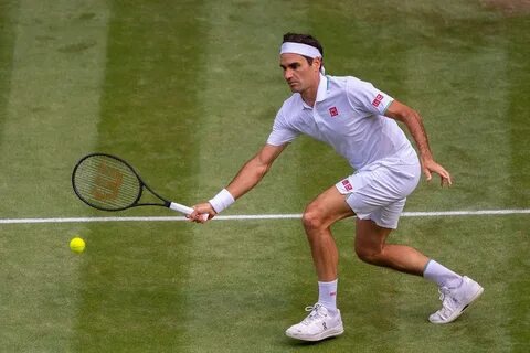 Roger Federer talks to the media.