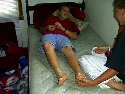 Tickling kid feet