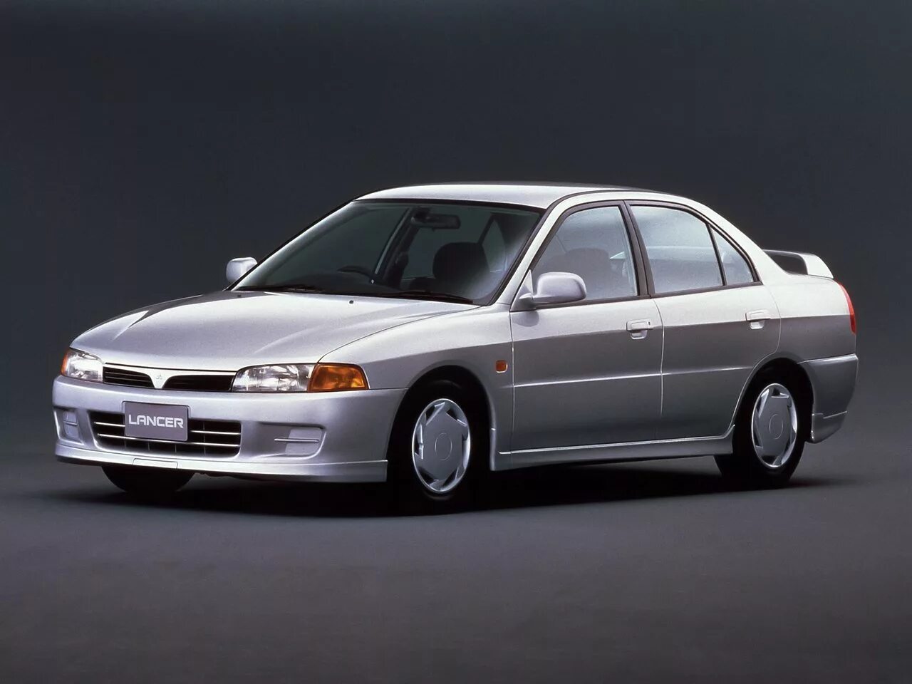 Митсубиси первого поколения. Mitsubishi Lancer 7. Mitsubishi Lancer 7 поколение. Mitsubishi Lancer VII 1995. Митсубиси Лансер 7 поколения.