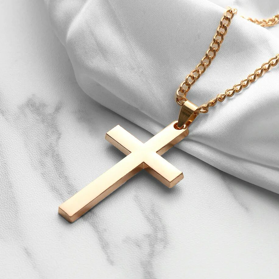 Крест нательный в руке на цепочке. Цепочка с крестиком женская. Приснилась цепочка с крестиком. Что означает во сне золотая цепь. К чему снится крестик на цепочке золотой.