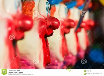 ...USA - September 17, 2016: Closeup of clown face that is part of a row of...