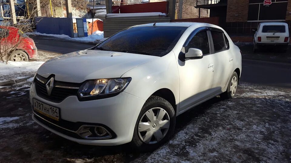 Рено Логан 2 белый лед. Renault Logan белый 174. Рено Логан 2 н866рк68. Рено Логан 2 белый тонированный. Купить рено волгоградская область