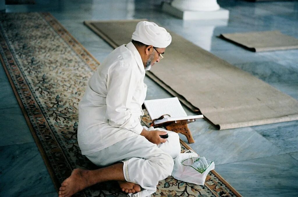 Quran reciting man.