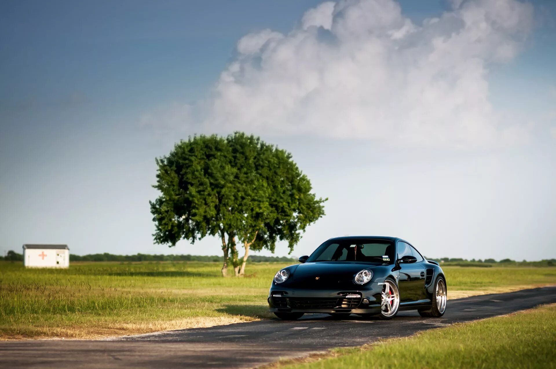 The car on the left is. Порше 911 черный. Porsche 911 Turbo. Порше Кайен 911. Porsche 911 Wallpaper.