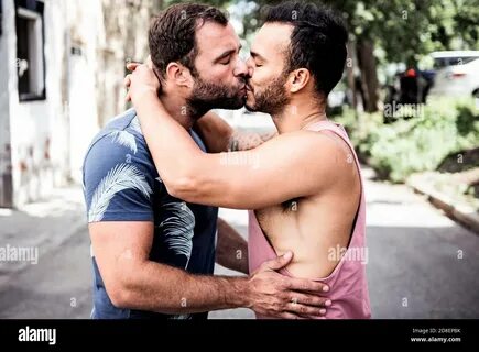 A Portrait of a happy gay couple outdoors in urban background Stock Photo. 