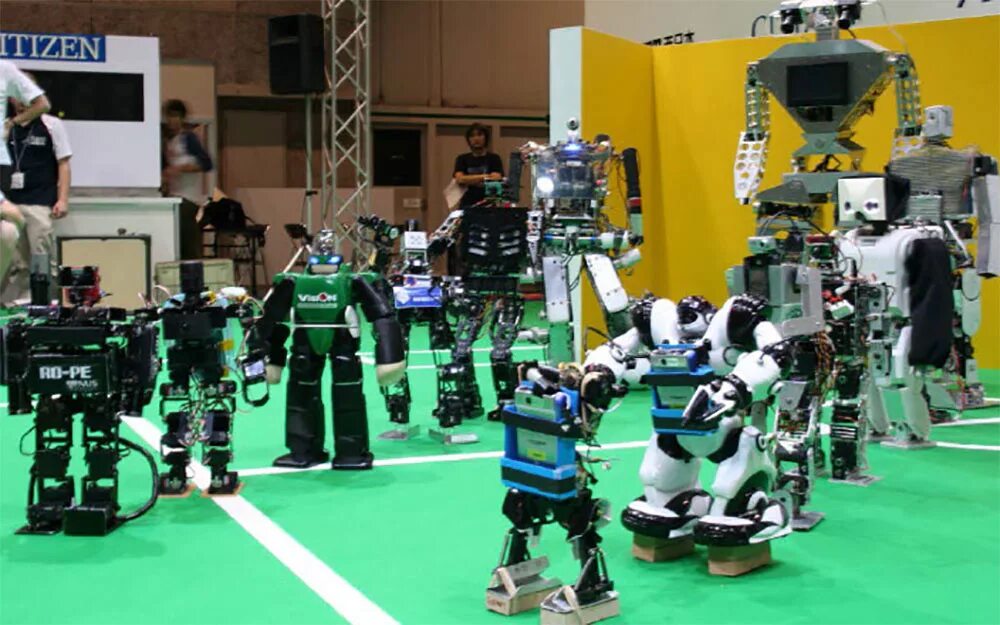 Турнир роботов. Турнир по робототехнике. Соревнования роботов. Соревнования по робототехнике. Роботы играющие в футбол.