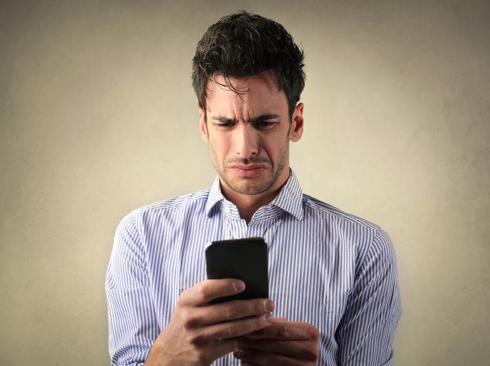 Disgusted man. Отчаянный человек. man with phone. angry looking man. sad man with phone.
