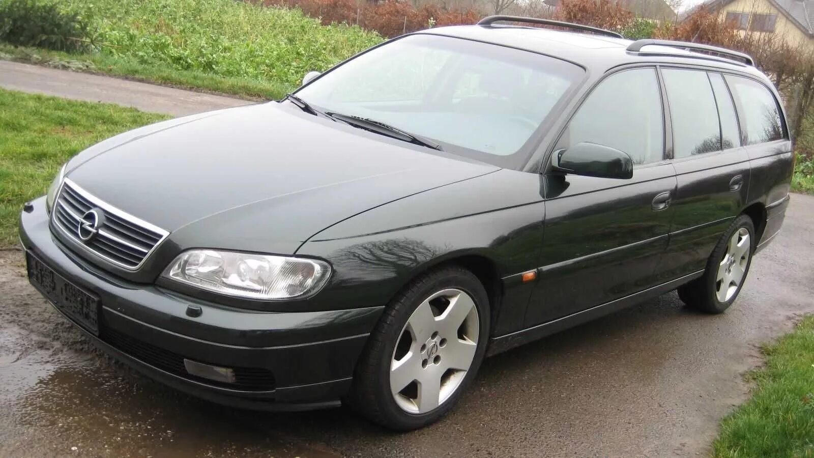 Купить опель омега б на авито. Опель Омега 2002 года. Opel Omega 2.2 Black. Kupit Opel Omega b ГАЗ бензин. Opel Omega темно зеленый.