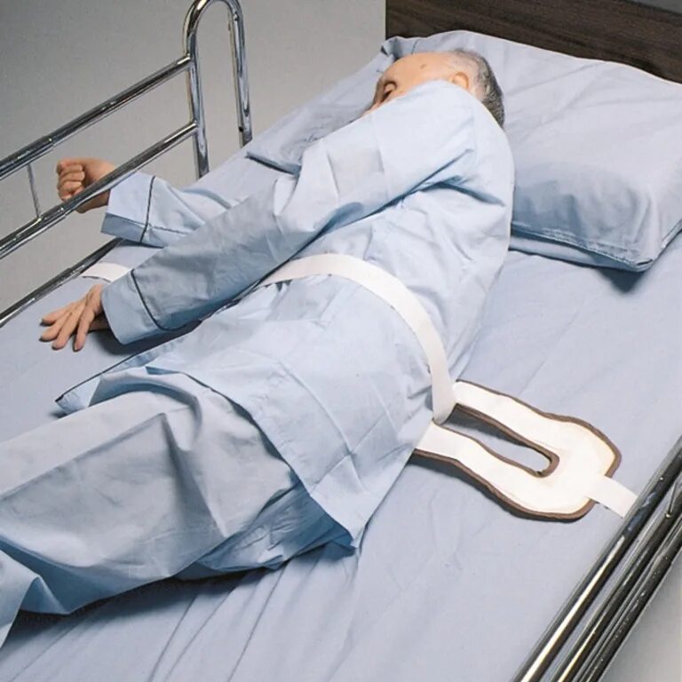 Фиксация в психиатрии. Фиксирующий пояс для фиксации пациента. Фиксаторы для лежачих больных. Ремни для фиксации больного. Привязанный человек к кровати.