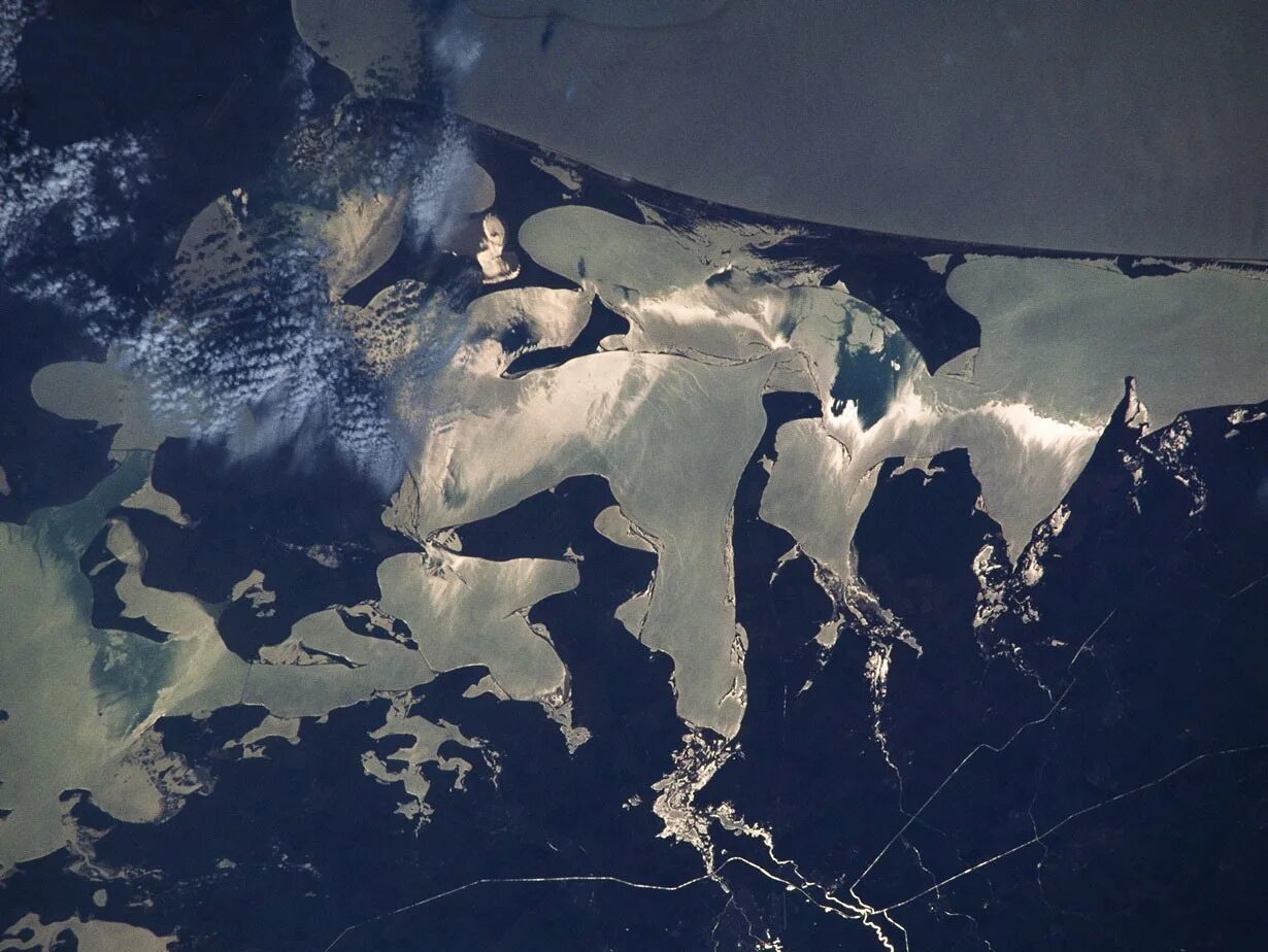 Мир затопили в тихом океане. Первые снимки земли из космоса. Океан из космоса. Земля с космоса тихий океан. Сахалин снимок из космоса.