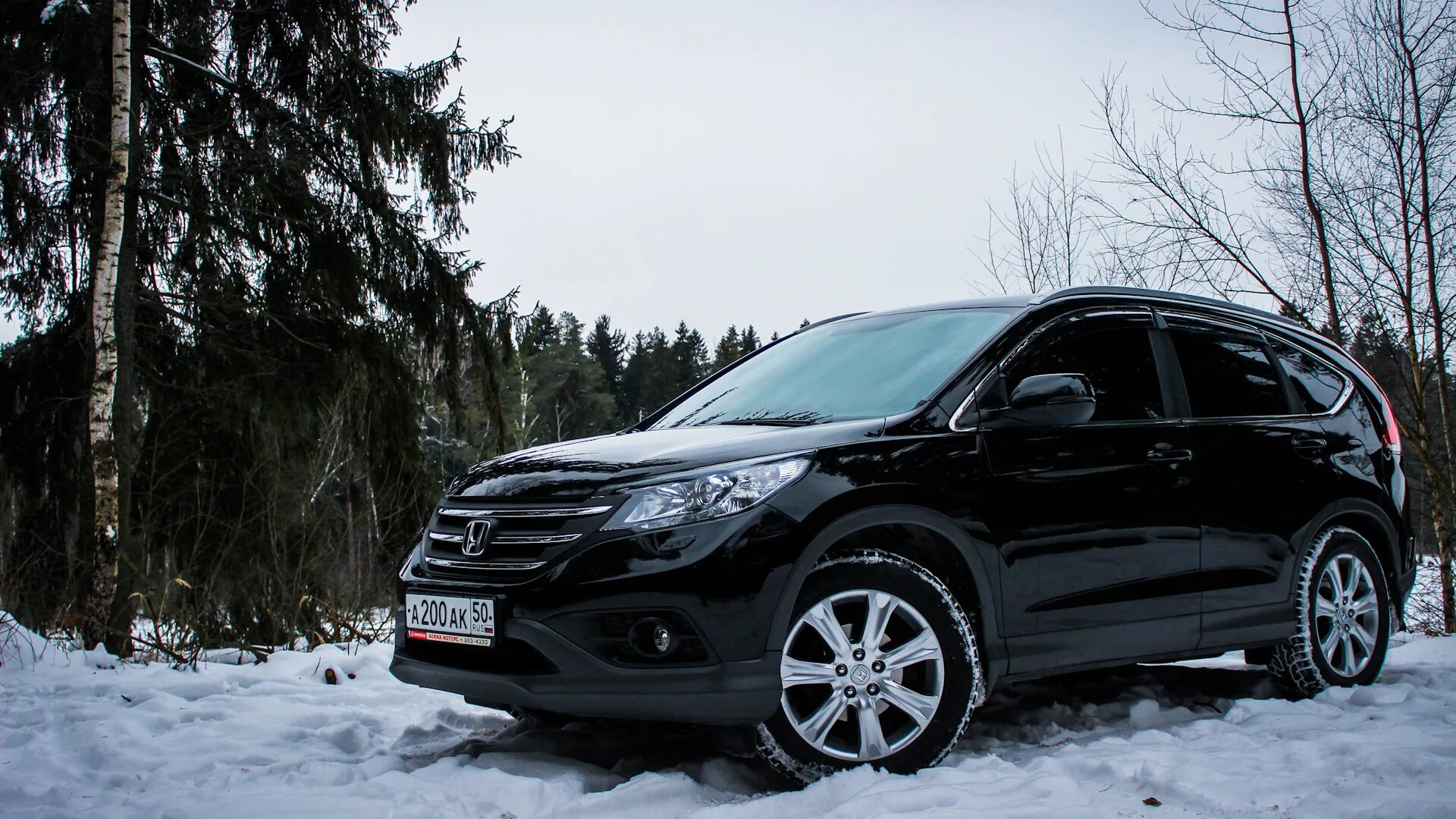 Купить срв в в новгороде. Хонда СРВ 4. Honda CR-V 4 поколение черный. Черная Хонда СРВ 4 поколения. Honda CRV 4 зимой.