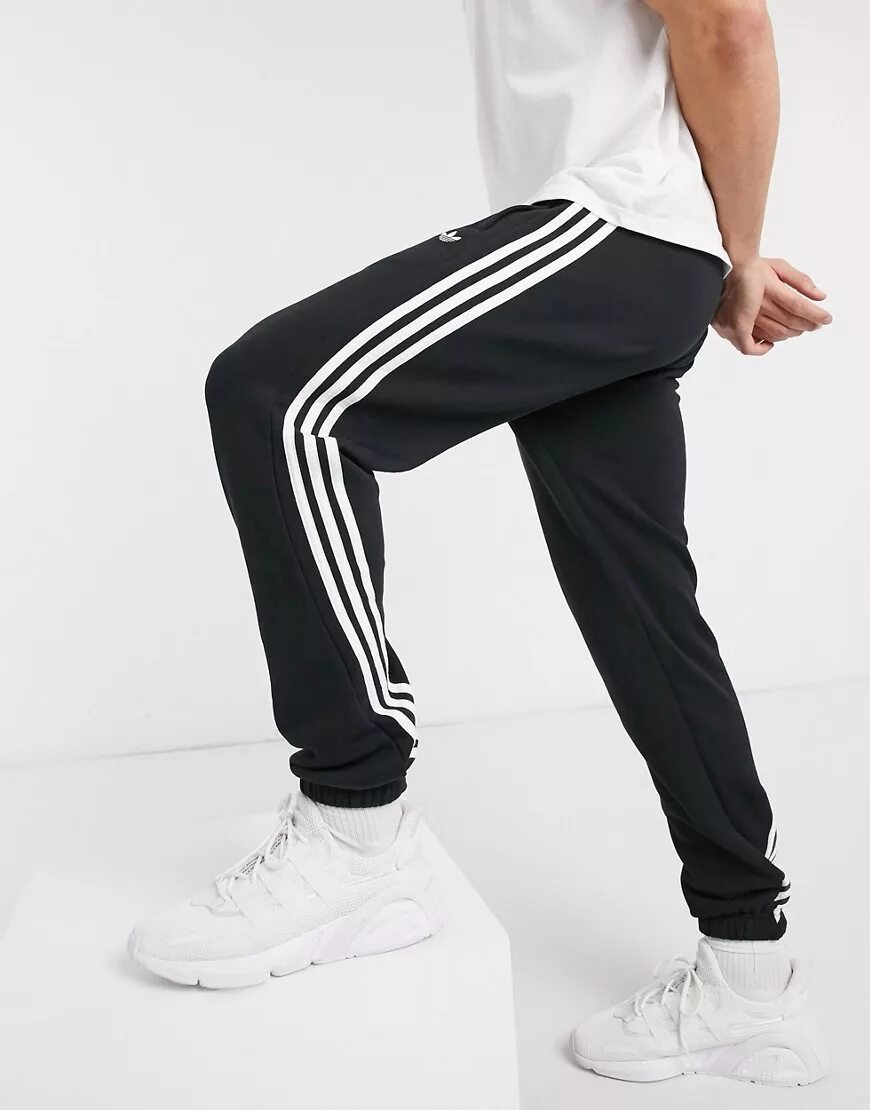 Спортивные штаны адидас с полосками. Du0497 adidas брюки. Брюки adicolor beckenbauer. Adidas 3 stripes pants. Штаны adidas originals 3 stripes.