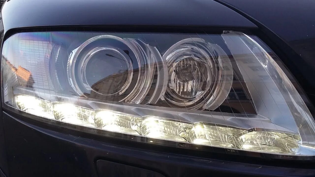 Audi afs. Фара audi a6 c6. фары ауди а6 с6. фара afs audi a6 c6. реснички на фары ауди а6 с6.