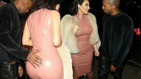 Kanye West pats Kim Kardashian's bum as they get very close at party f...