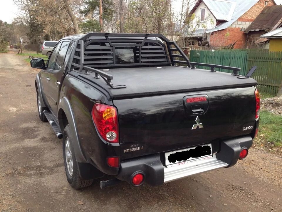 Налог на пикап. Дуги на l200 Mitsubishi. Кунг Mitsubishi l200 abcлюкс. Крышка багажника l200. Дуги на Митсубиси л200.