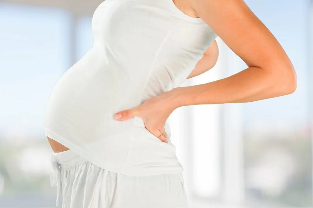 Боли во время беременности. Осанка беременных. У беременной болит спина. Беременная со спины. Спина беременной женщины.