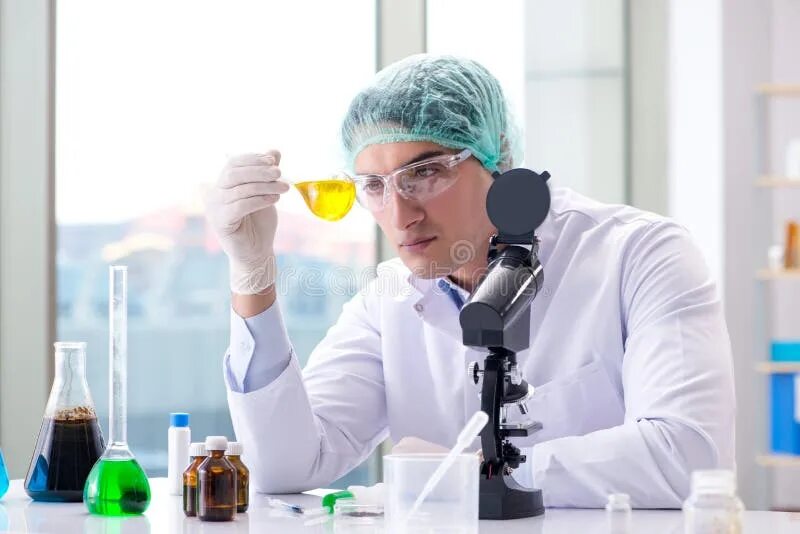 Working in science. Ученый работает с предметом. oganesyan scientist at work. scientist is working on a project.