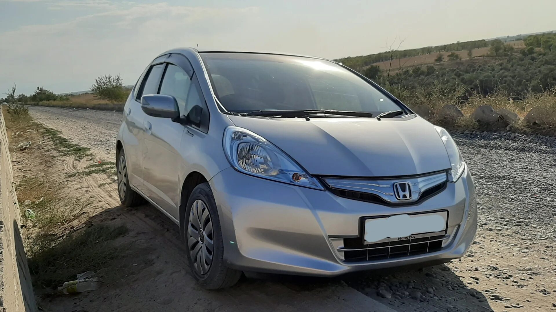 Фит гибрид 2011. Honda Fit 1.3 Hybrid. Хонда фит гибрид 2010. Хонда фит гибрид 2011 года. Хонда фит 2 гибрид.