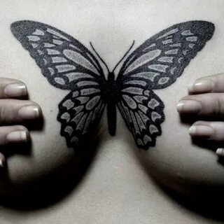 Butterfly tattoo on boob