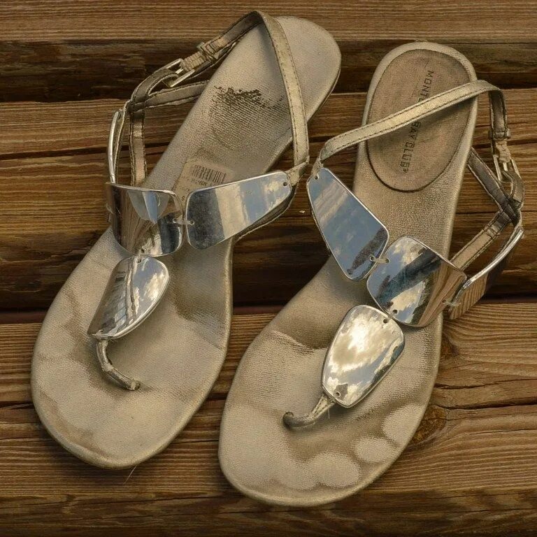 Worn sandals. Well worn Shoes Flats. Well worn Sandals. Well worn stinky Shoes Flats. Smelly well worn Suede Shoes.