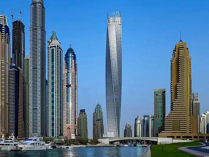 Небоскреб на украинском. Дубай Тауэрс изогнутые небоскребы. Кольцевой небоскреб в Дубае. Самый высокий небоскрёб в мире 2022. Многоэтажный дом в Дубае.