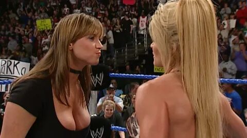 Stephanie McMahon gets a whoopin' from Trish Stratus. 