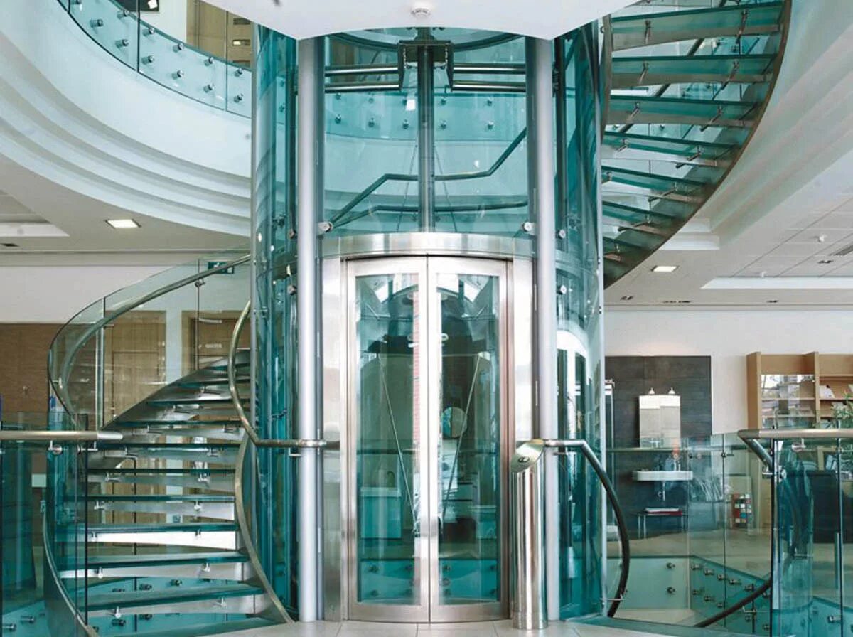 панорамный лифт отис шахта лифта. стеклянный наружный лифт. лифты пассажирские 2100х1100. панорамный лифт отис шахта лифта. остекление шахты лифта.