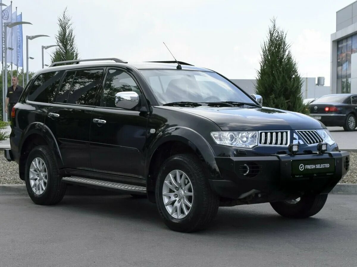 Mitsubishi pajero sport 2012. Pajero Sport 2012. Мицубиси Паджеро спорт 2012. Mitsubishi Pajero Sport черный 2012. Mitsubishi Паджеро спорт 2012.