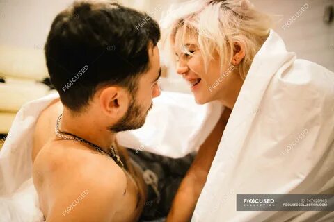 Download Пара весело на ліжку #147420945 high-end stock photo. 