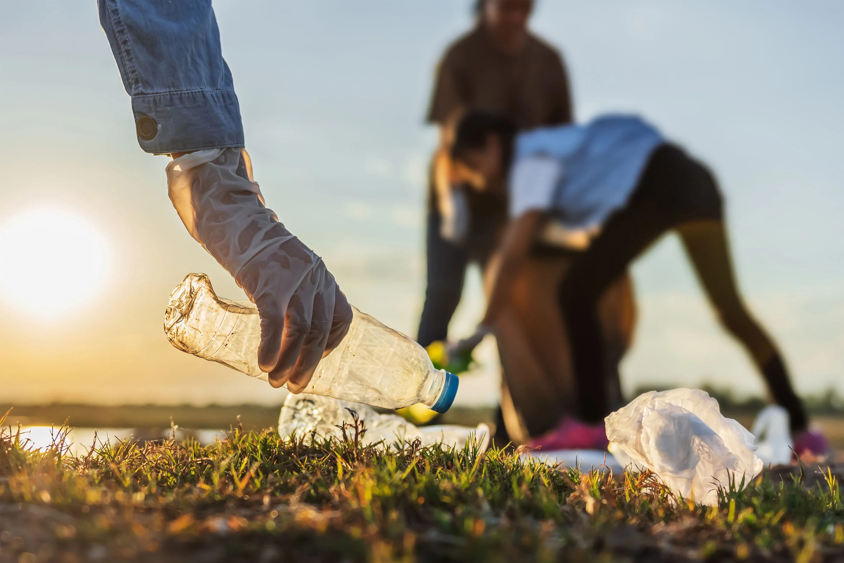 Picking up garbage. People litter. pick up litter. picking up. pick up garbage.