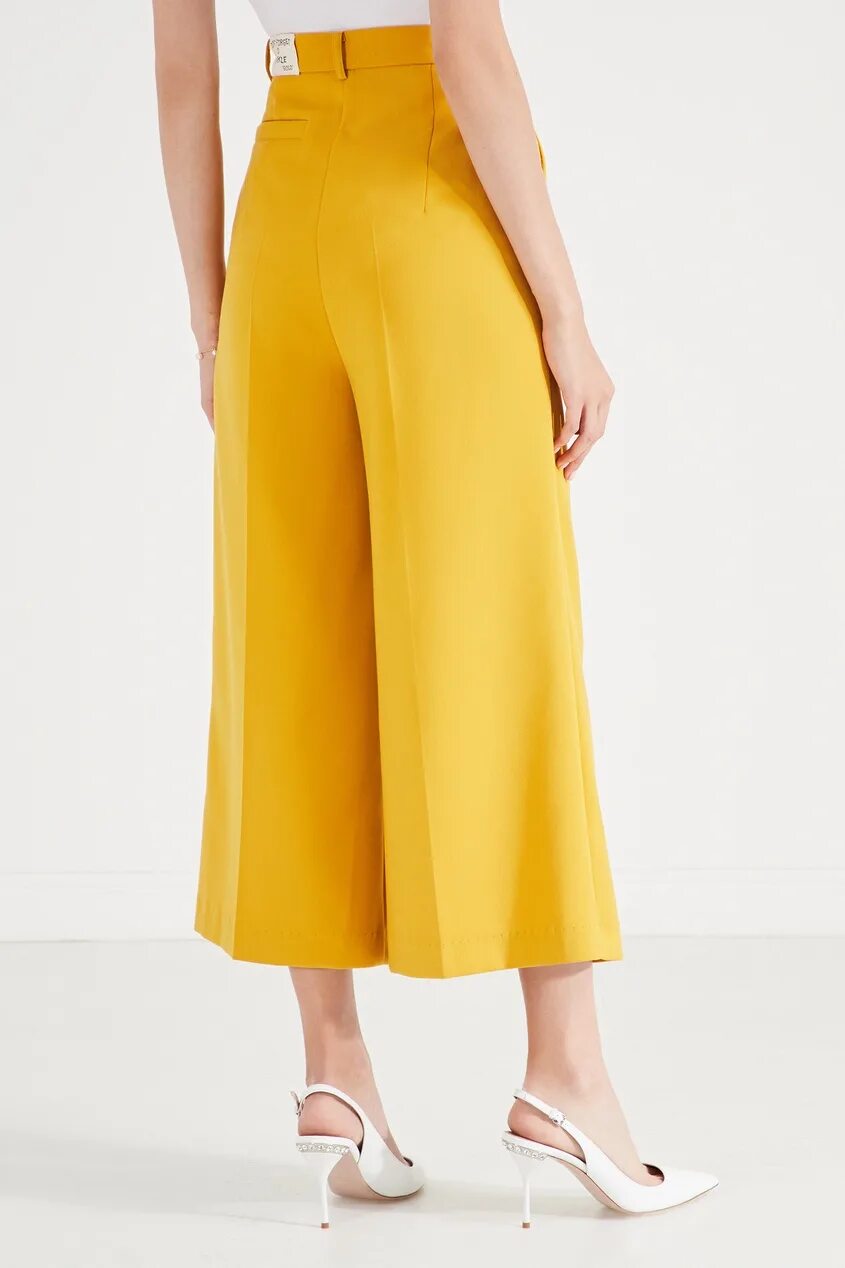 Брюки палаццо stradivarius. Золотые брюки палаццо. Желтые штаны широкие. Желтые летние брюки. Топ и широкие брюки с завышенной талией.