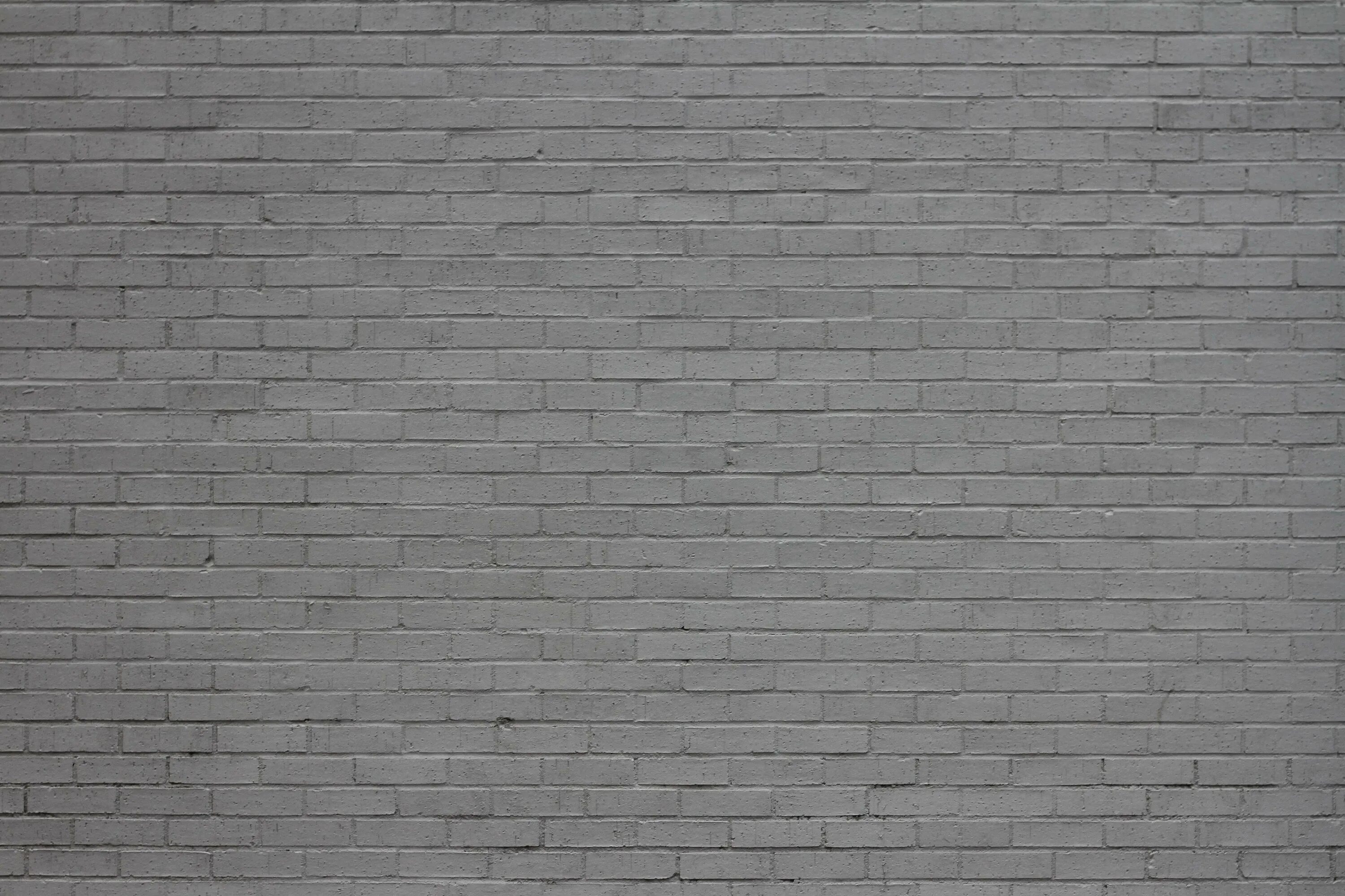 стена серый кирпич. серый кирпич текстура. стена из серого кирпича. стена из серого кирпича. кирпичный фон.