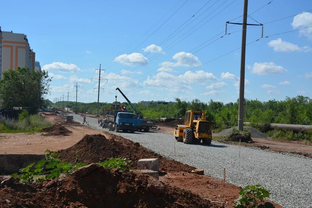 Строительство городских дорог. Оренбург безопасные качественные дороги. Строительство дорог в Оренбурге. Дорожные работы Оренбург. Дорожные работы фото.