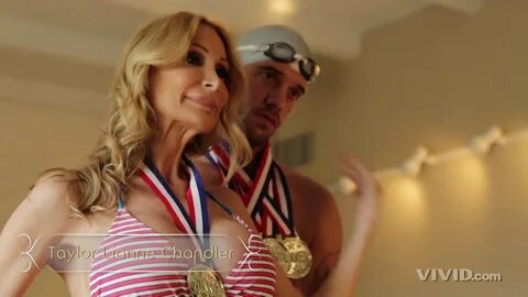 Busty Blonde and Her Younger Guy Pose with Medals 