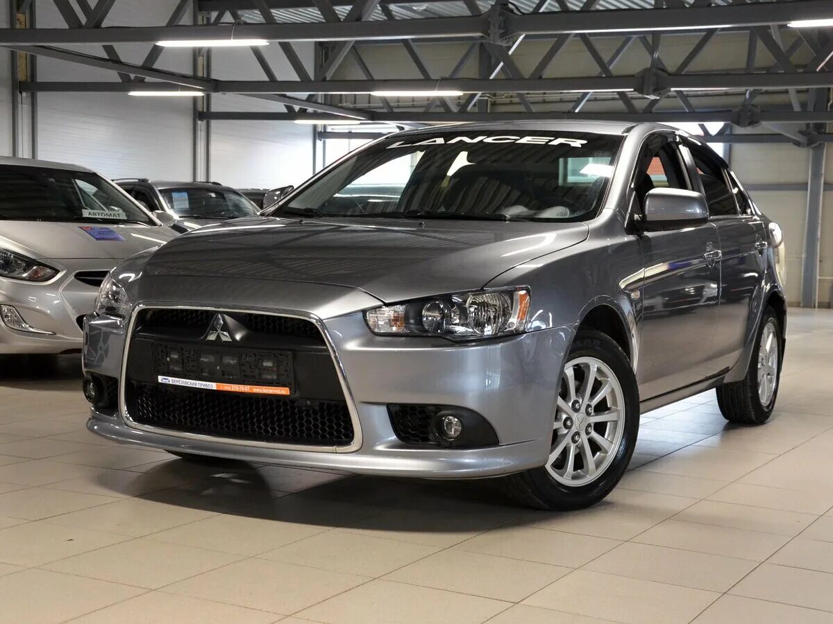 Ланцер 10 лет. Mitsubishi Lancer x Рестайлинг 2012. Лансер 10 HTCN. Митсуби ИСИ лансер10 рест. Митсубиси Лансер 10 Рестайлинг.