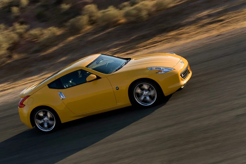 Nissan speed. 2009 nissan z. ниссан купе 370z. желтый ниссан 370z. nissan 370z 2009.