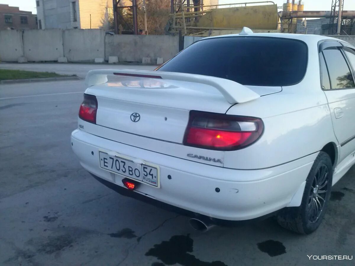 Купить тойоту улыбку. Toyota Carina 1993. Спойлер Toyota Corona 190.