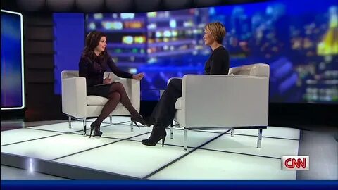 Erin Burnett - maroon silk blouse.