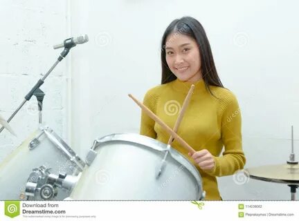 Asian Teenage Girl Plays the Drums in Studio Stock Photo - Image of.