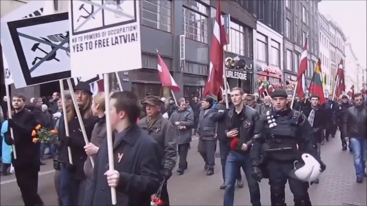 Следующий марш. Каратели сс марш. парад сс в латвии свастика. парад фашистов в латвии в 2025. марш сс в риге гиф.