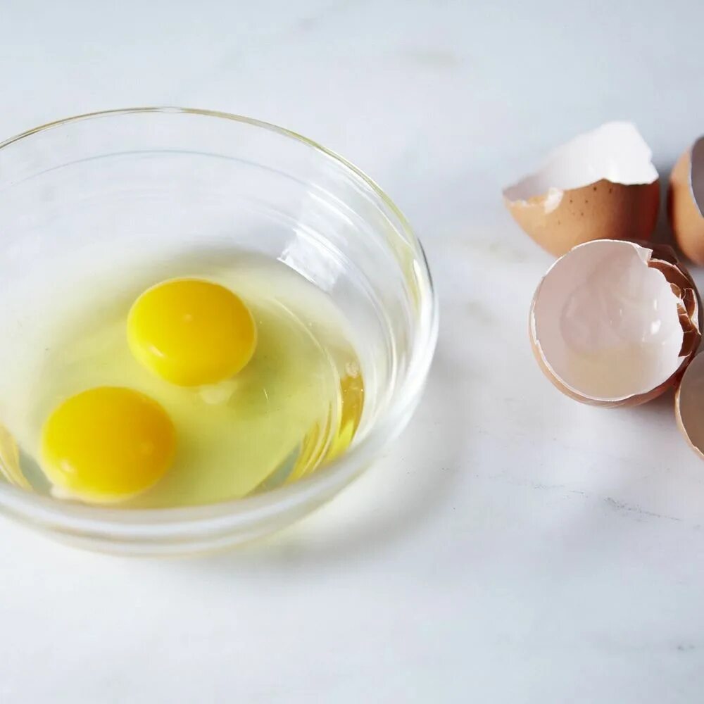Raw eggs. Egg bowl. egg eyes bowl. picture out eggs in a bowl. eggs and flower in a bowl.