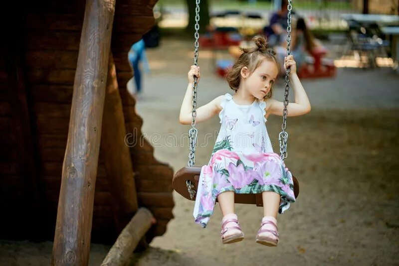 The girl got stuck on the playground