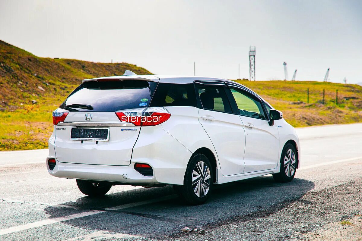 Honda shuttle hybrid 2015. робот honda shuttle. хонда шатл 2017г. Honda shuttle. хонда фит шаттл гибрид 2016.