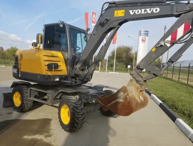 Экскаватор бу вольво. Volvo ew60. Вольво EW 60c. Колесный экскаватор Volvo ew60c. Колесный экскаватор Volvo ew205d.