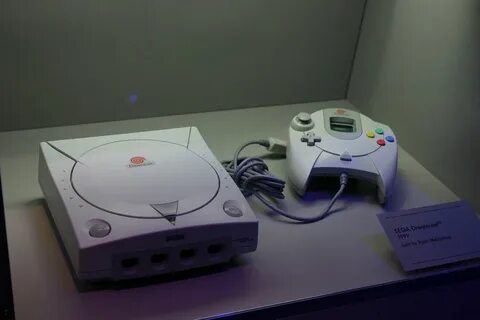 Ryan Somma/Flickr. photo of a Sega Dreamcast and its controller on display ...