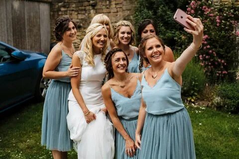 Bridesmaids selfie with the bride at a wedding.